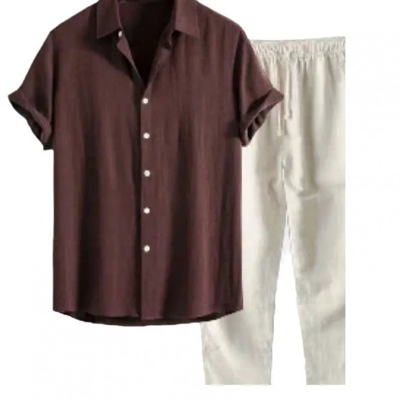 Man wearing a loose casual short-sleeve linen-look shirt and matching trousers in a solid colour.