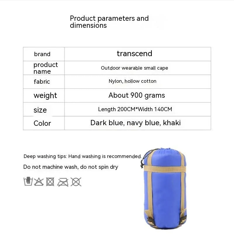 Adult wearing grey nylon cloak sleeping bag as wearable camping blanket outdoors