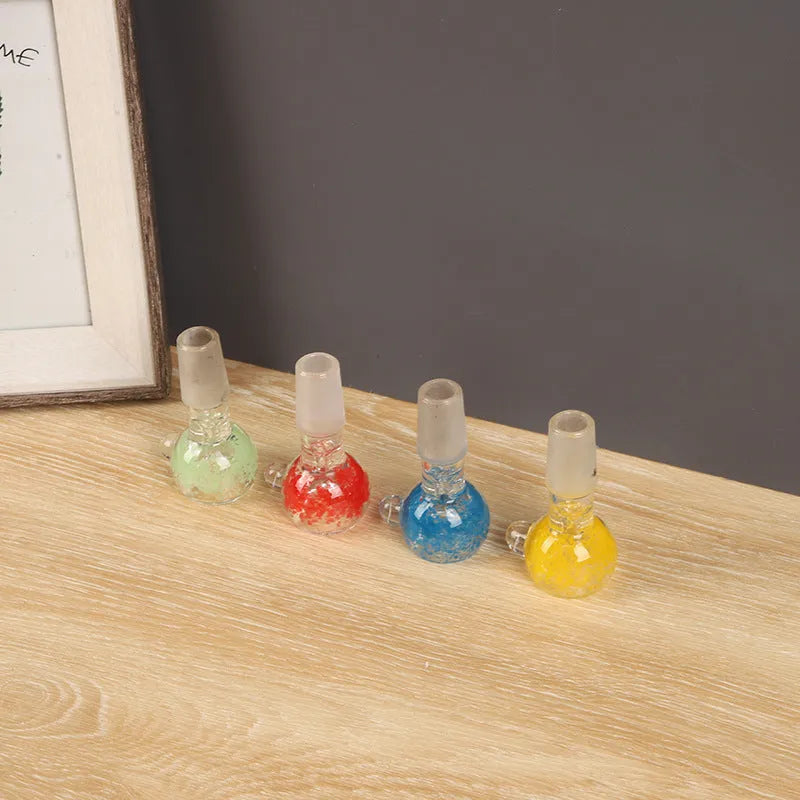 A transparent coloured glass trumpet-shaped smoking pipe, 7cm long, on a plain background.