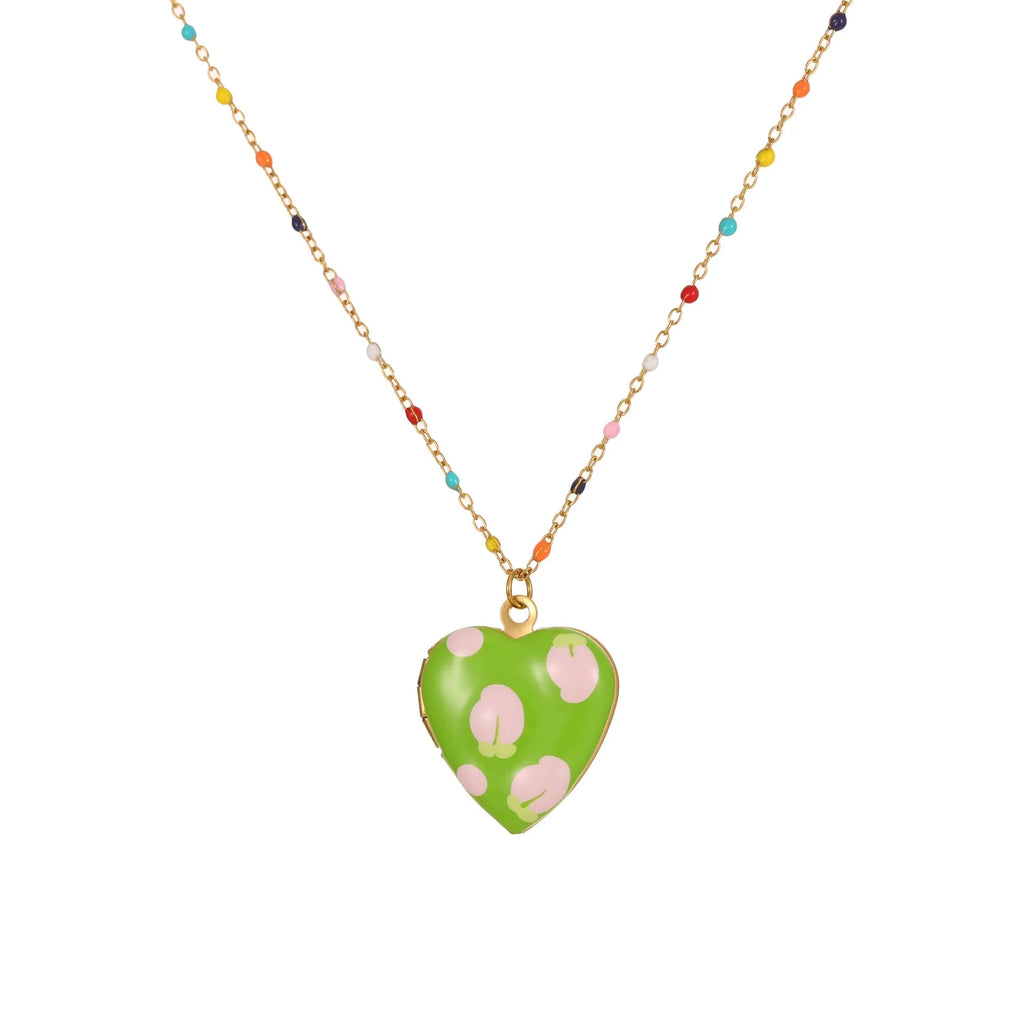 Stainless steel necklace with gold plated heart pendant featuring fruit design on adjustable chain