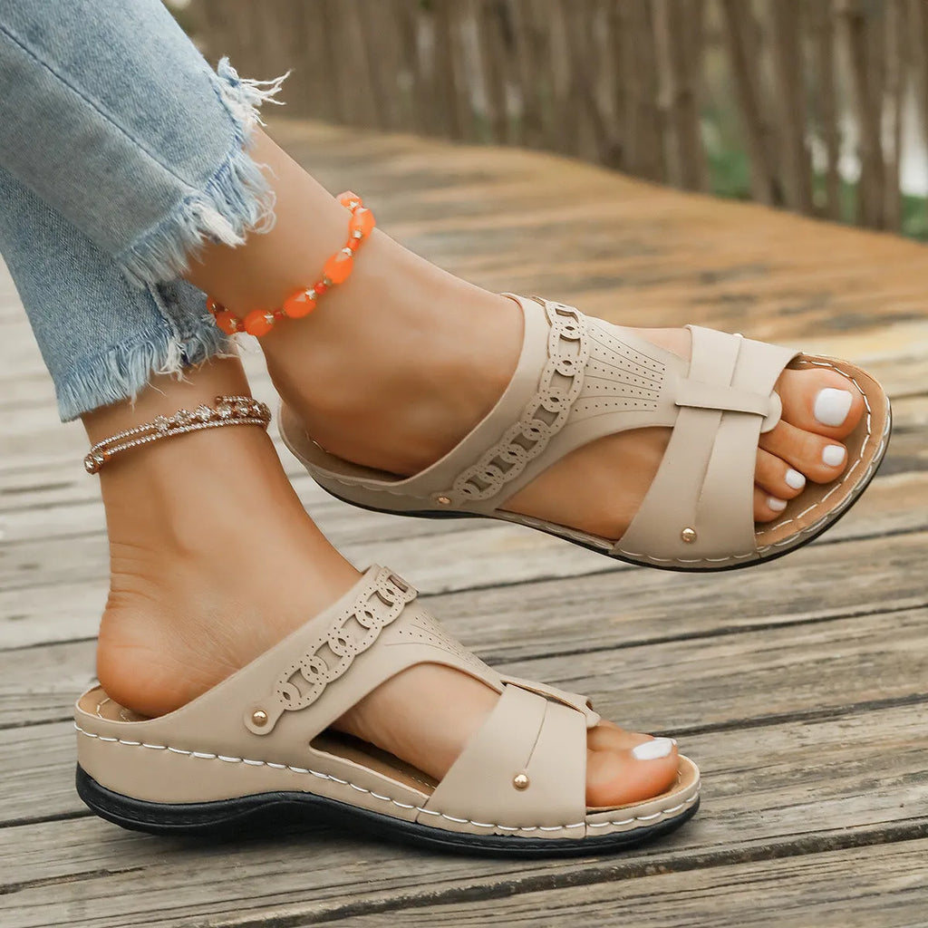 Casual slope heel roman style slippers in blue with fish mouth toe design and rubber sole.