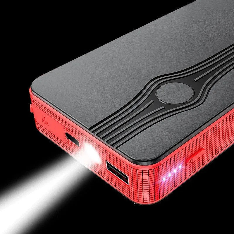 Red K4-E portable car jump starter power bank with USB port and display, shown next to included data cable.