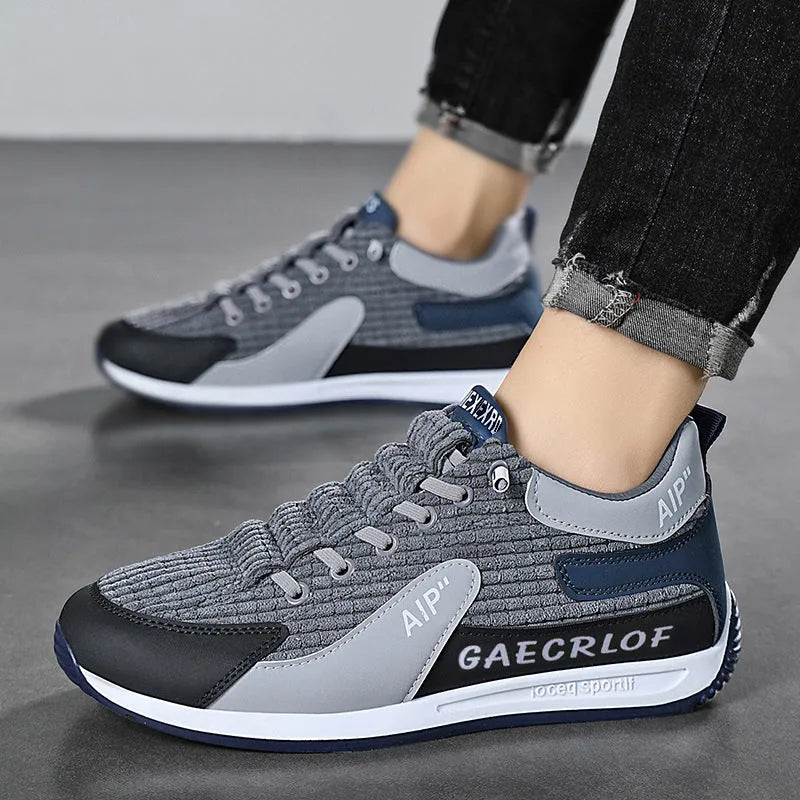Men's grey and green mesh running shoes with lace-up closure and round toe design