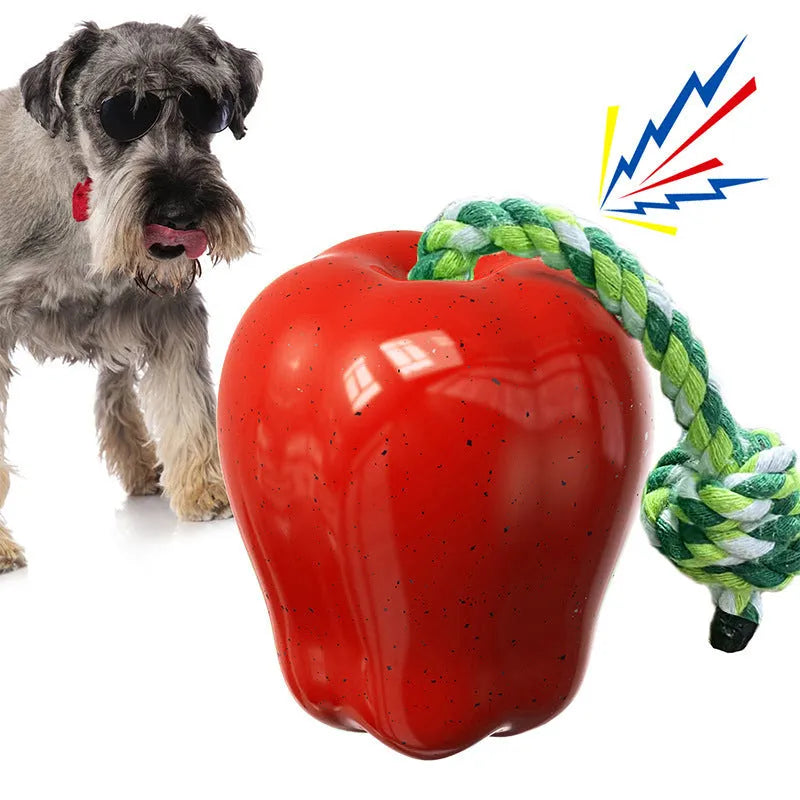 Green Apple-shaped plastic dog chew toy with food dispenser and squeaker for interactive play
