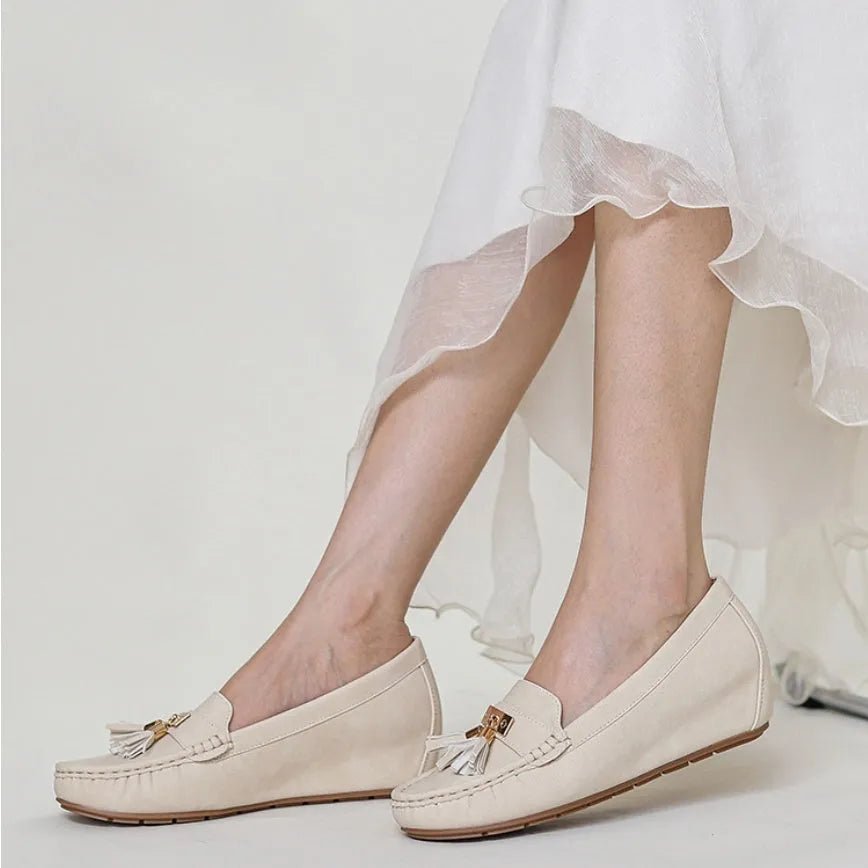 Flat heel height increasing insole shoe in milky white colour with round toe and slip-on design