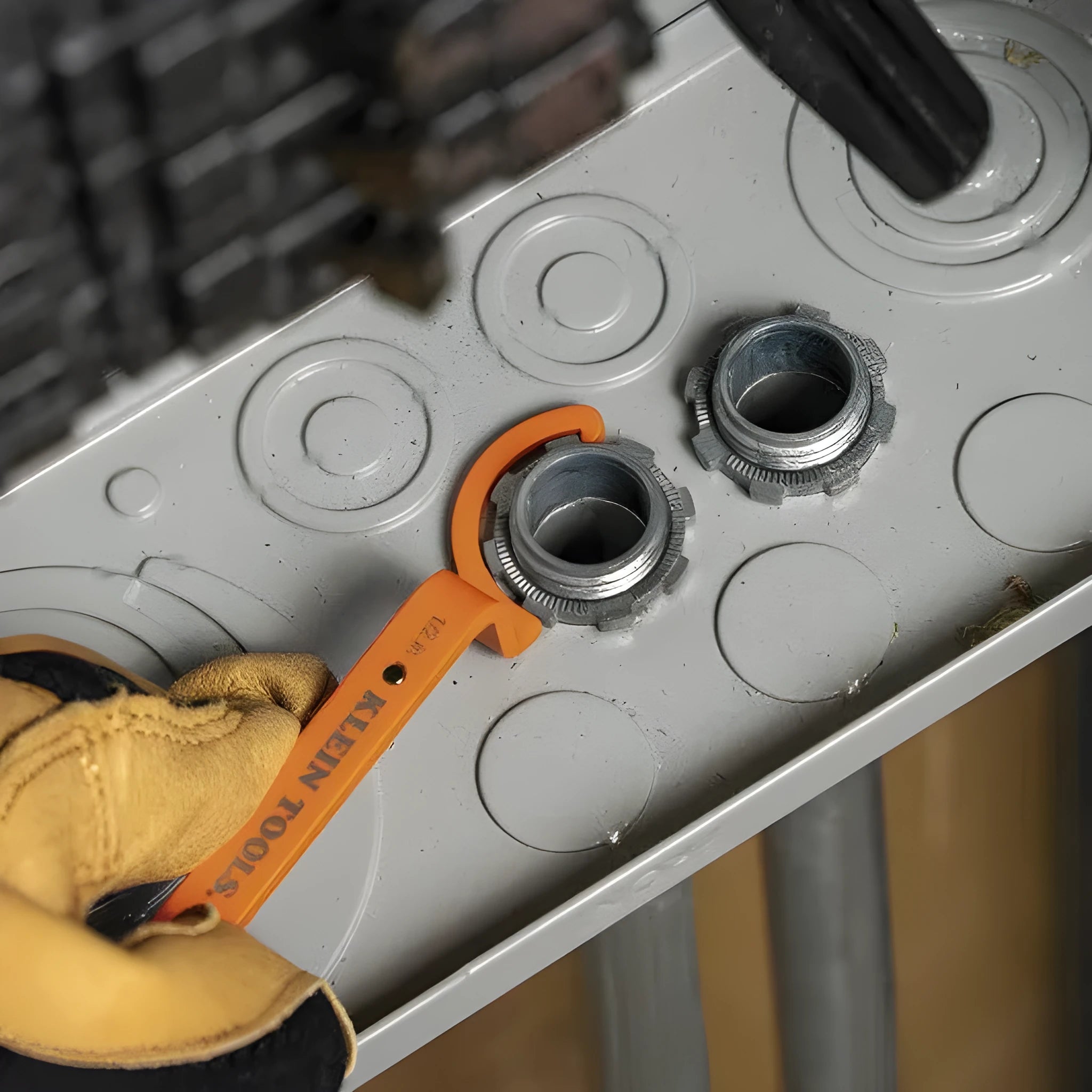 Three crescent wrenches with magnetic suction and catheter locking in orange, grey, and black colours