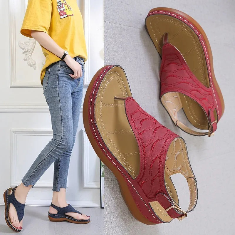 Women's casual wedge heel sandals with adjustable buckle strap in solid red colour