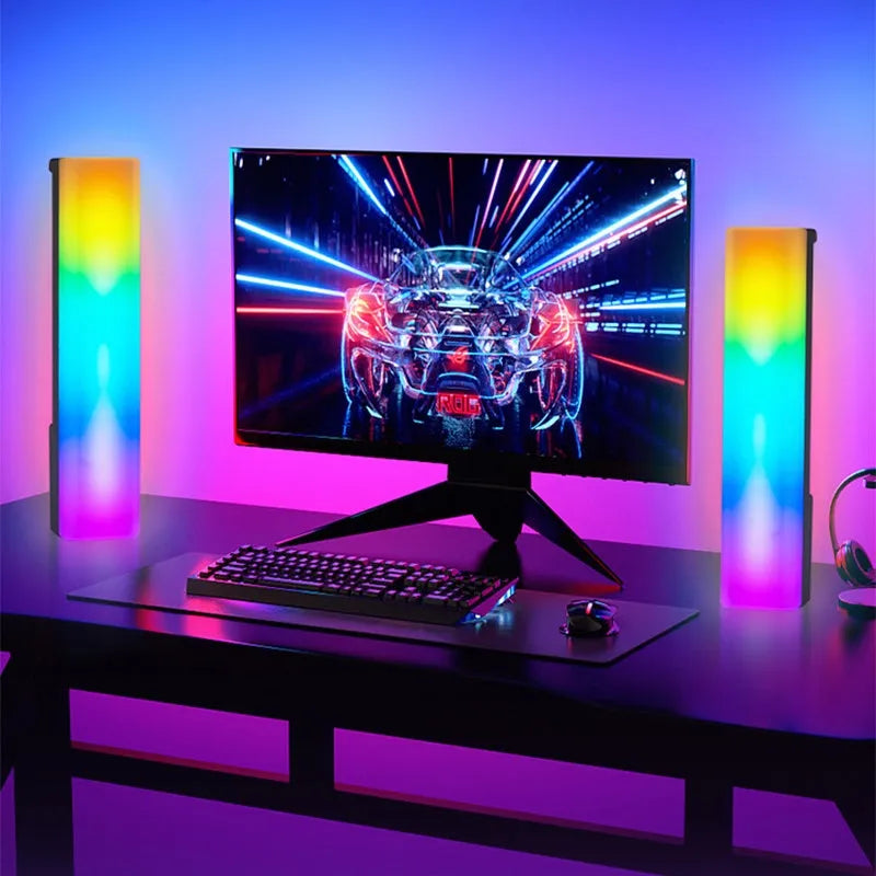 Black and white 3D RGB voice-activated music rhythm ambiance lamp on a table.