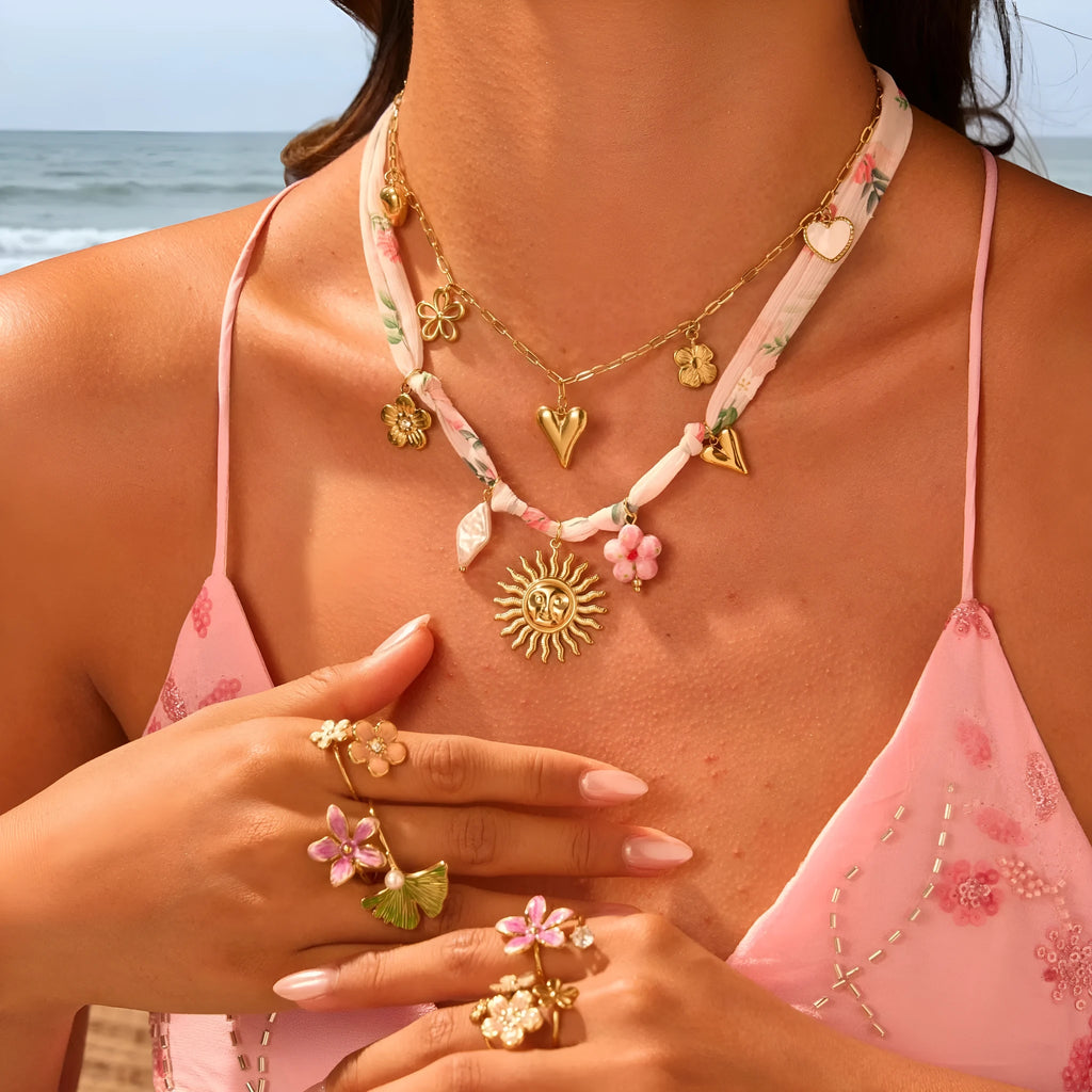 Gold plated stainless steel necklace with a choice of a geometric sun or heart pendant on a 41-50cm chain.