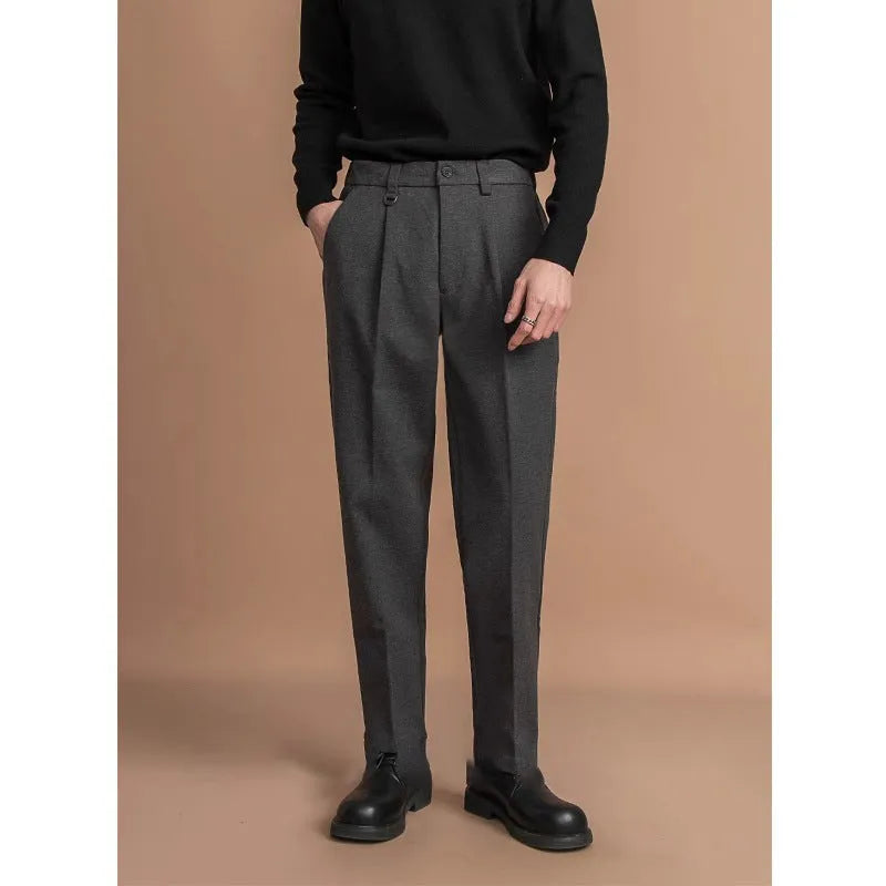 Men's straight-fit polyester trousers in dark grey, laid flat showing waistband and leg cut.