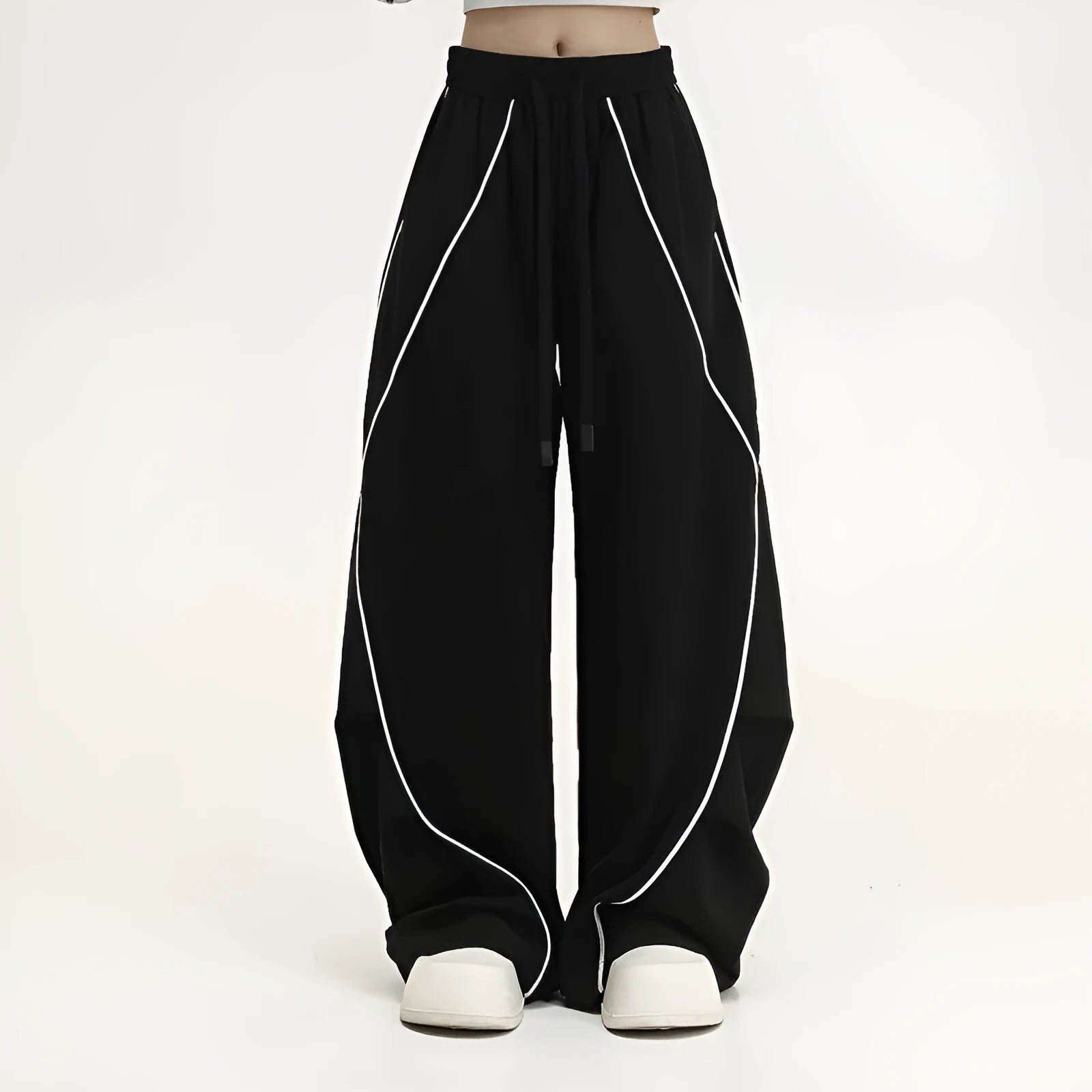 Black striped hip hop trousers with wide-leg pleated design showing mid-waist styling