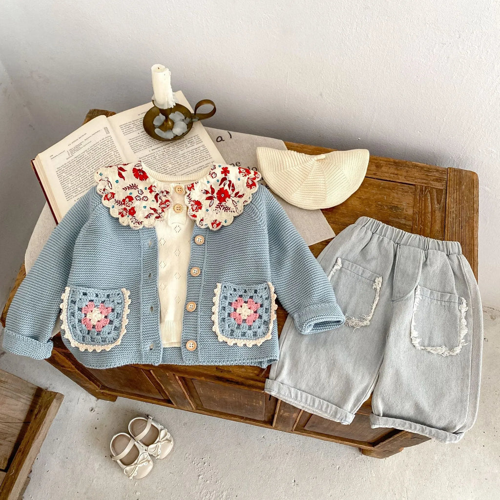 Children's hand crochet cotton cardigan in smokey blue with round collar and hollow flower pocket