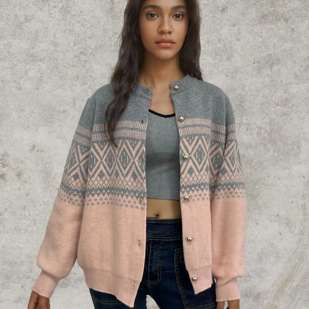 Grey alpaca wool women's cardigan with pink diamond knit contrast sleeves.