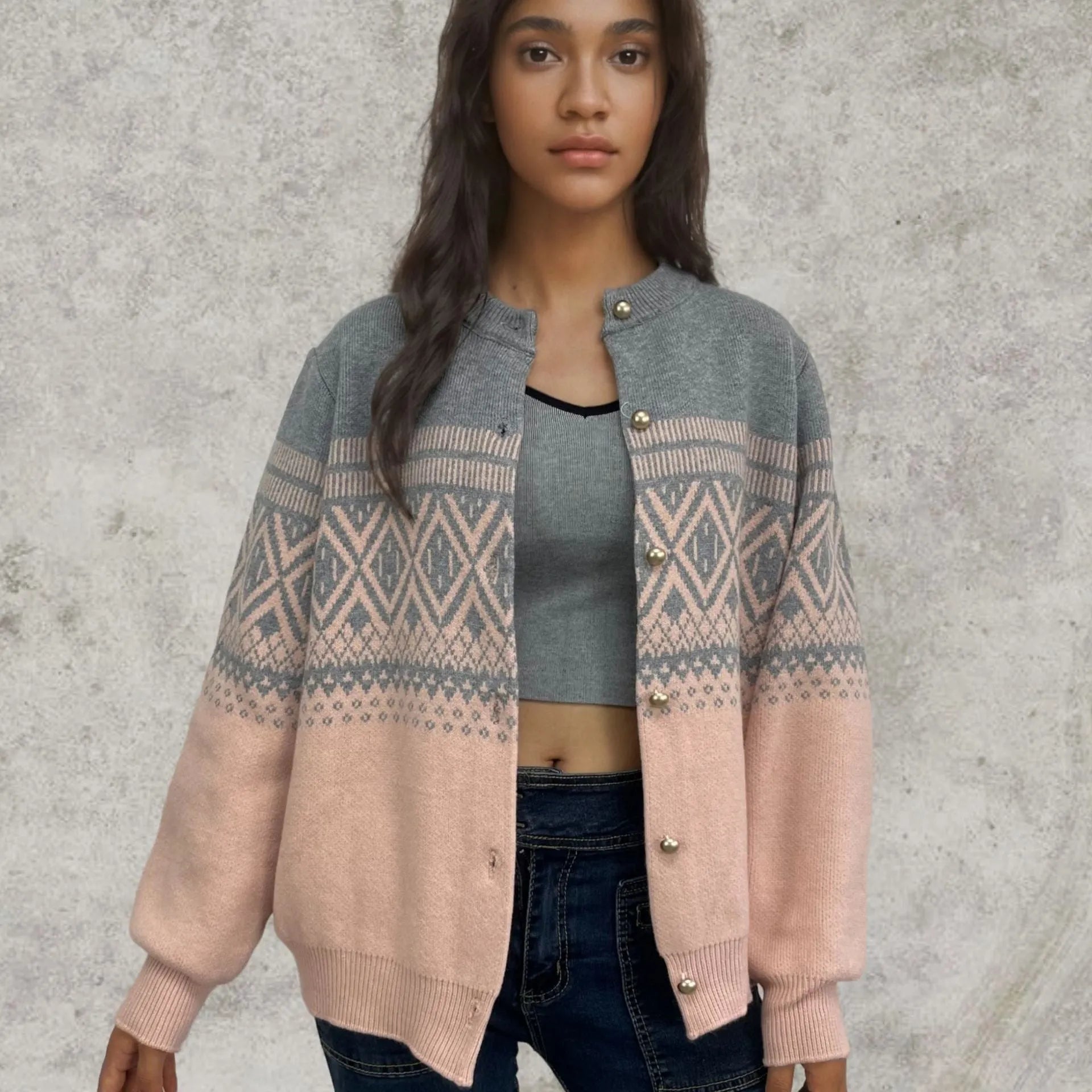 Grey alpaca wool women's cardigan with pink diamond knit contrast sleeves.