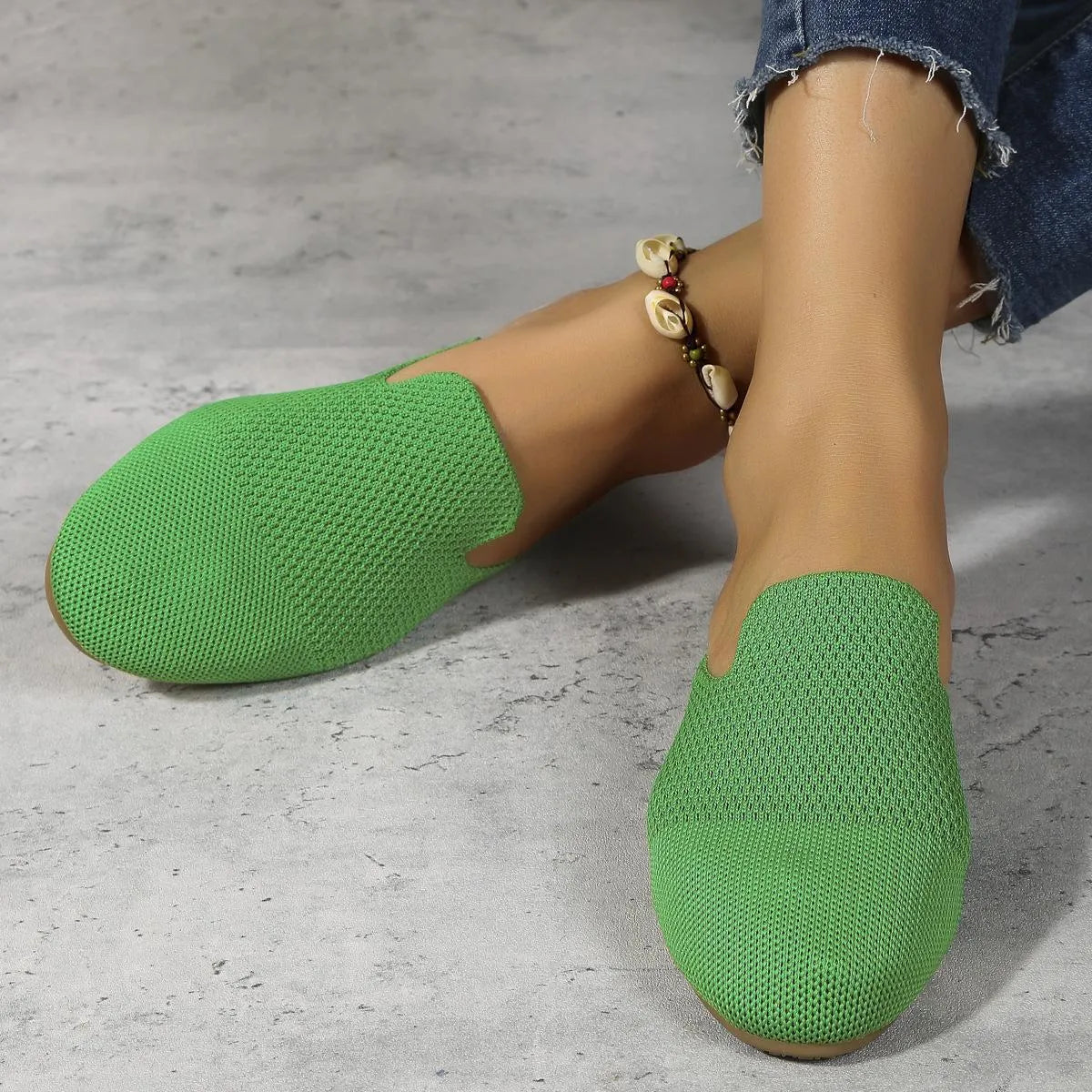 Mesh sandals with round toe slip-on design in candy colours showing cloth upper and flat rubber sole