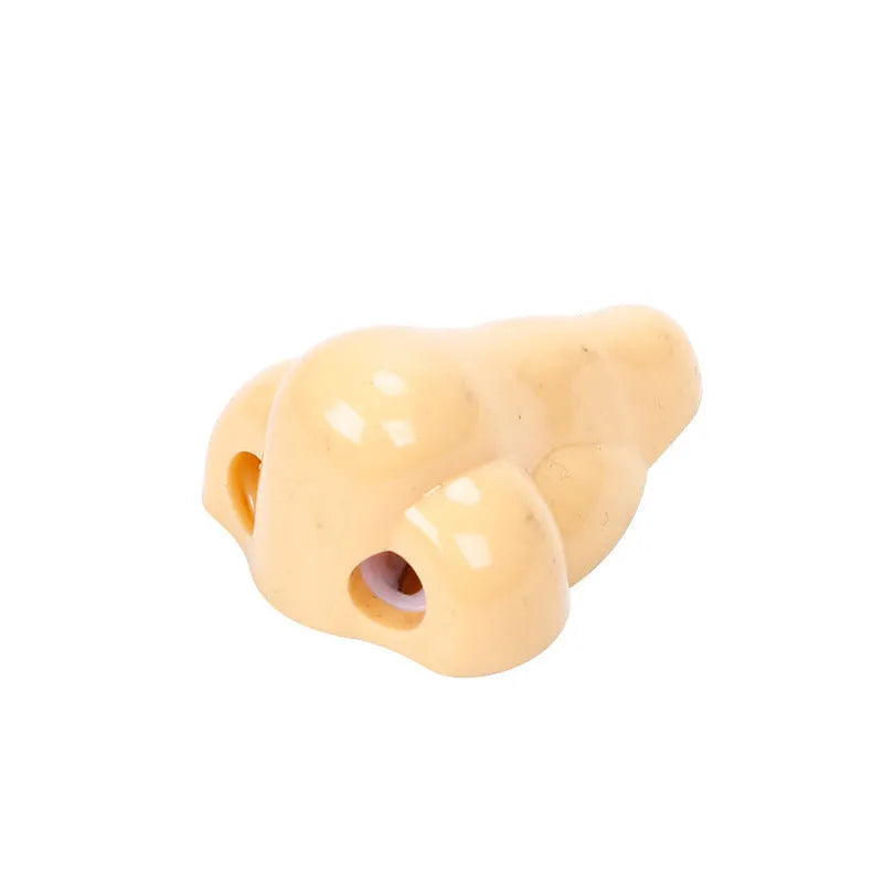 Flesh colour plastic pencil sharpener with large nostril opening for students