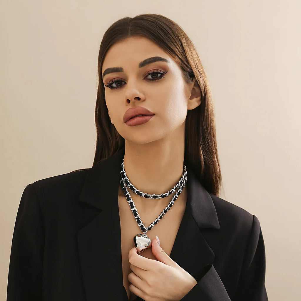 Big Love double-layer chain necklace with heart pendant in gold finish on woman
