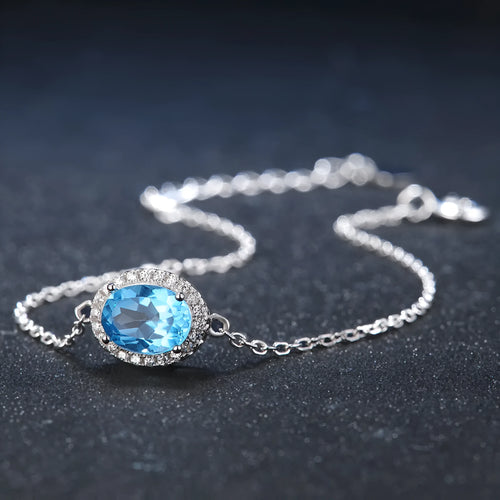 925 sterling silver blue topaz jewellery set with geometric design including earrings, ring, pendant and necklace