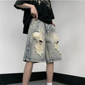 Blue retro denim shorts with a wide-leg loose fit and tattered detailing on a mannequin.