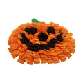 Orange polar fleece pet slow feeder mat with pumpkin-shaped pads for dog or cat food.