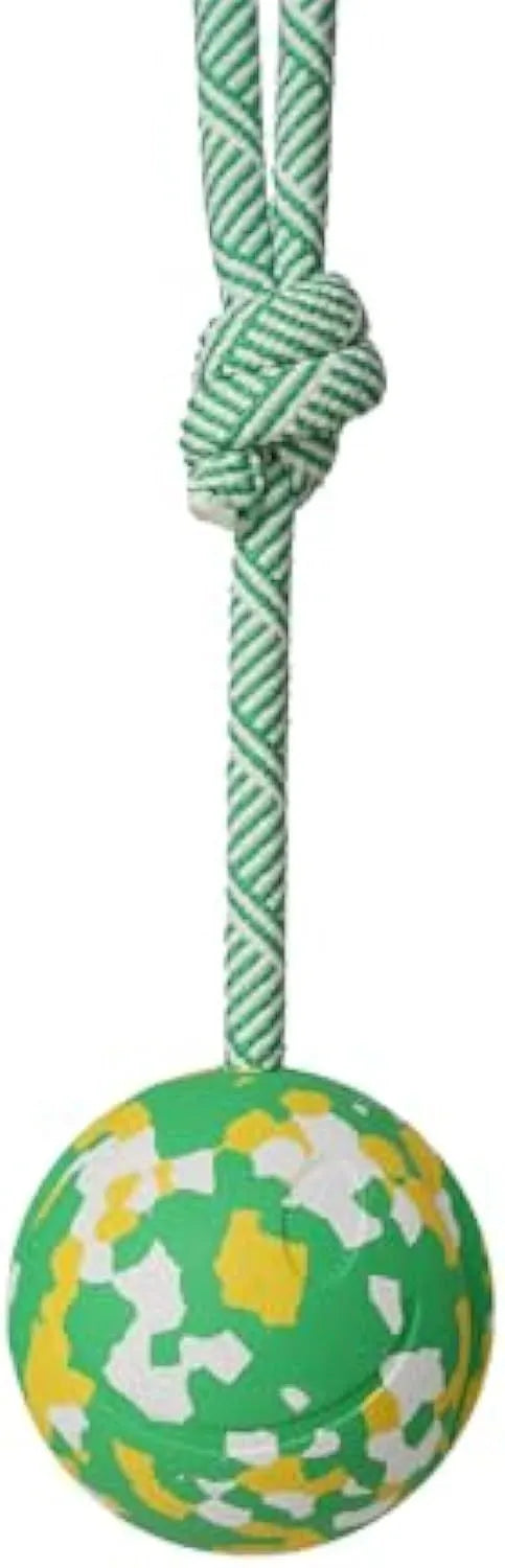 Natural rubber dog ball attached to a nylon rope for fetch and tug games.