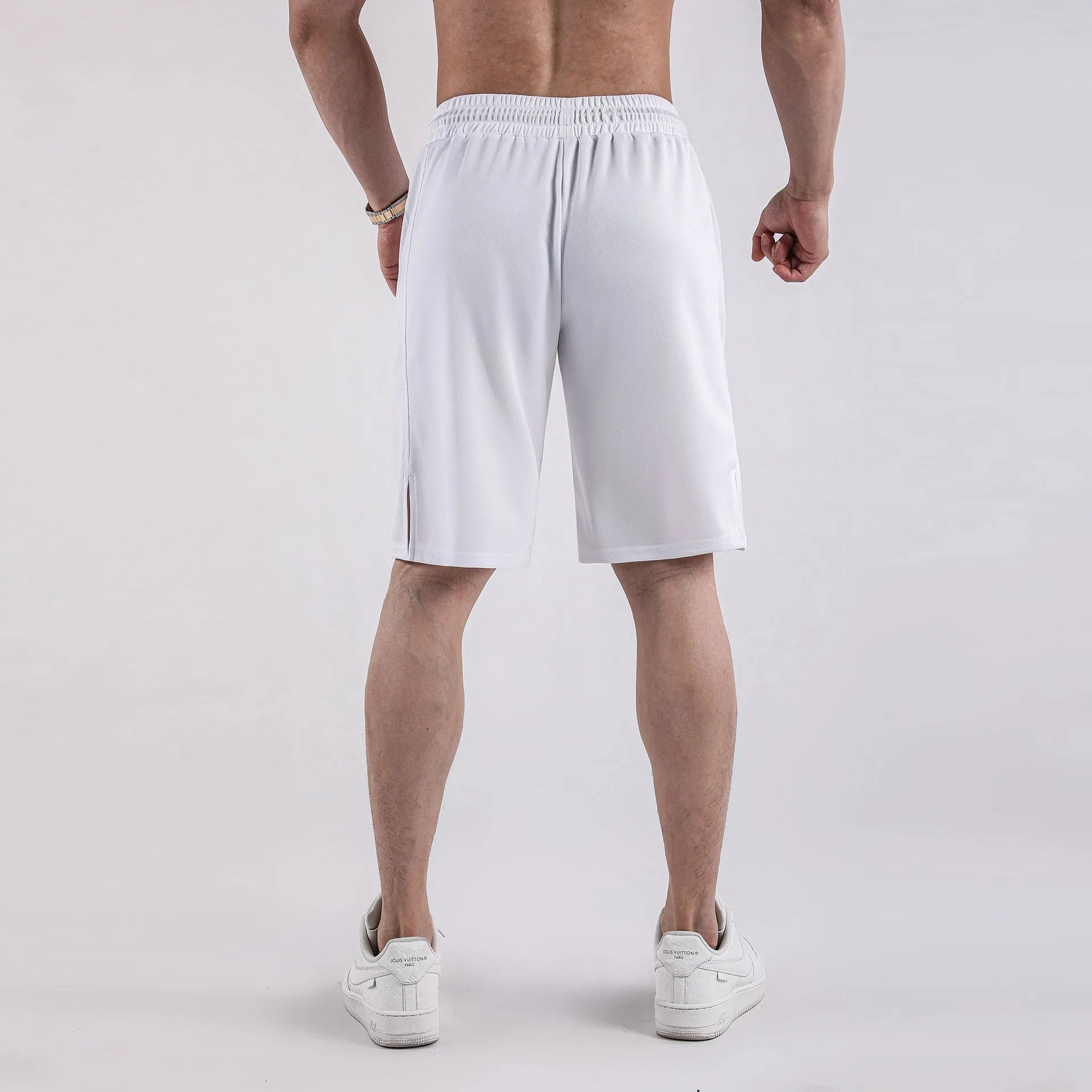 Men's black quick-drying mesh shorts with elastic waist and fifth pants length