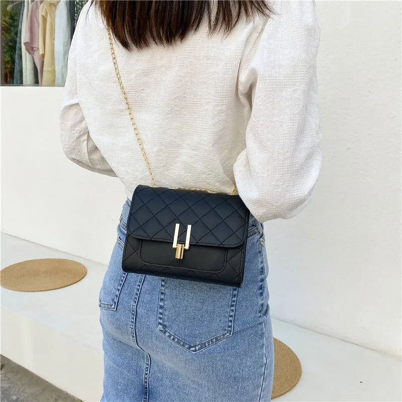 Women's minimalist crossbody bag with diamond lattice chain detail in black, white or green