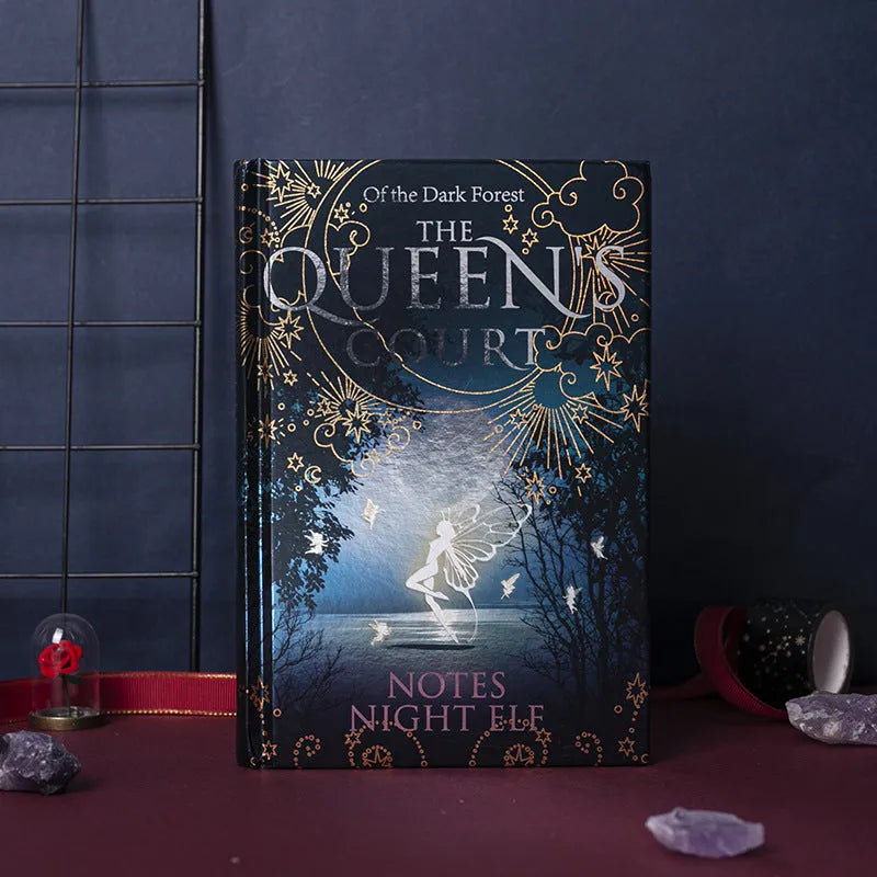 Blue and purple luminous hardcover A5 notebook open to show full-colour illustrated pages.
