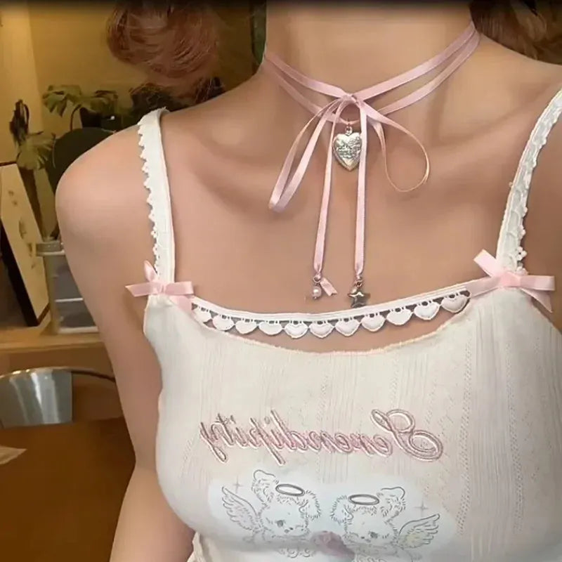 Women's ribbon love pendant fashion necklace in alloy with electroplated finish on clavicle chain.