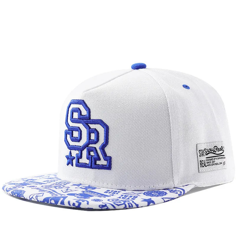 Black cotton baseball hat with white embroidered letters on the front, showing the dome crown shape.