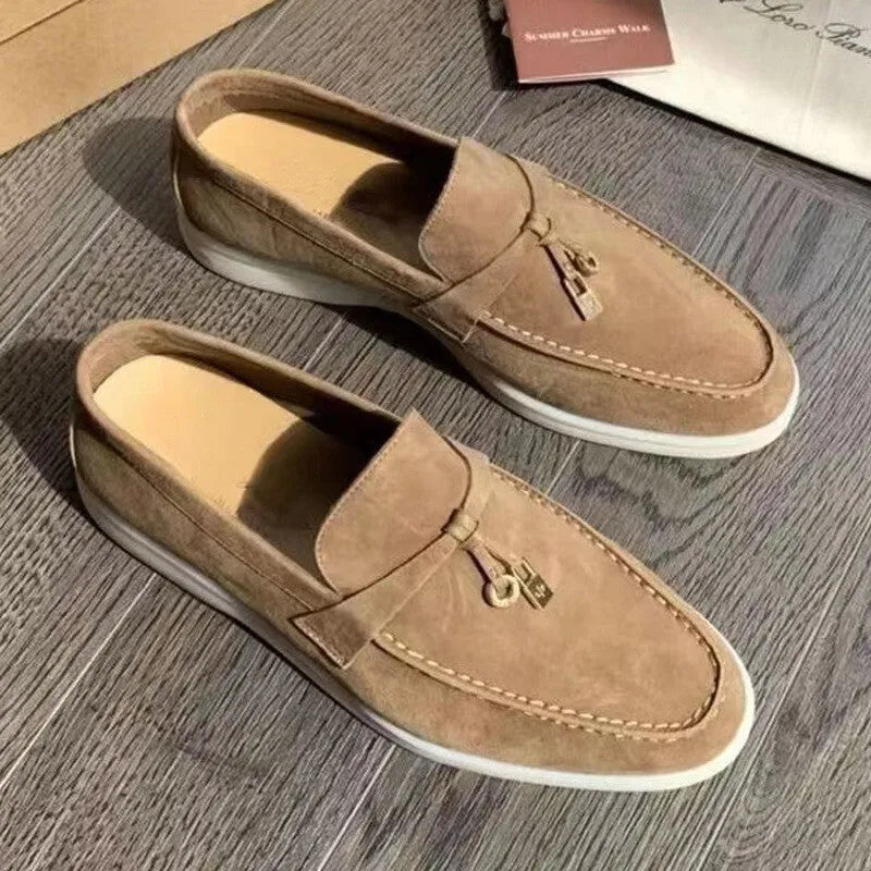 Casual slip-on Gommino loafers in black with round toe, rubber sole, and high-top design.