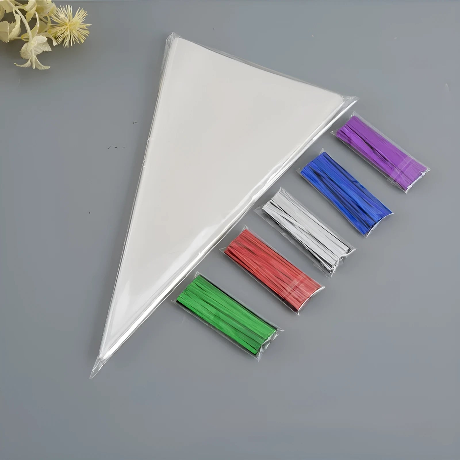 Clear triangle plastic packaging bag with integrated wire tie closure showing three size options