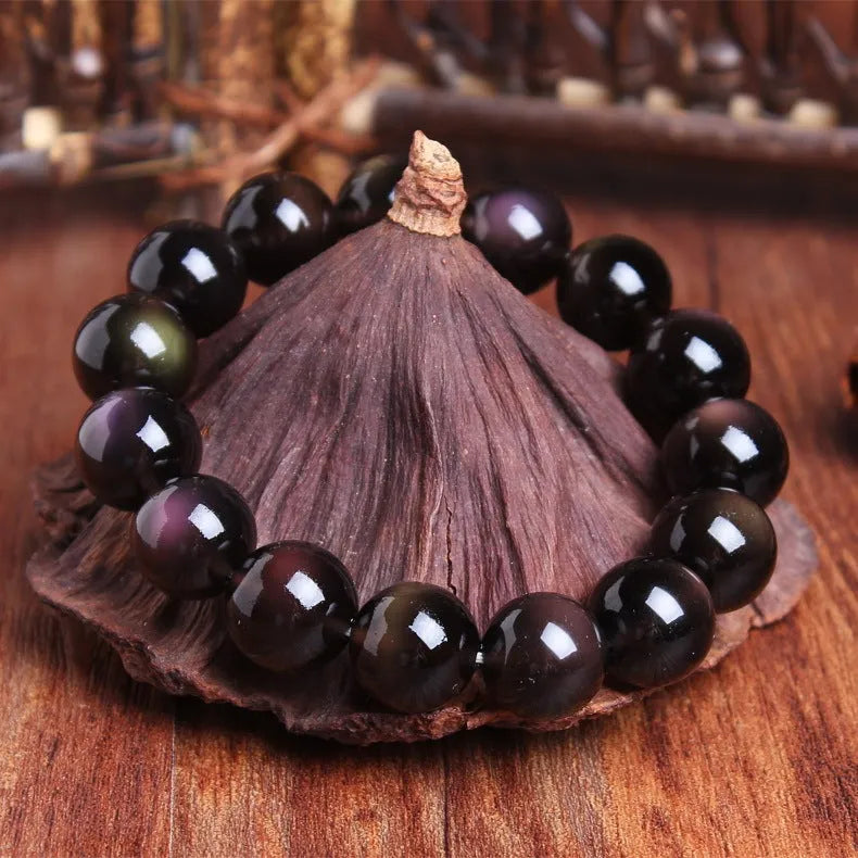 Polished crystal Pi Xiu bracelet with geometric beads in ice stone colour, showing size options on wrist.