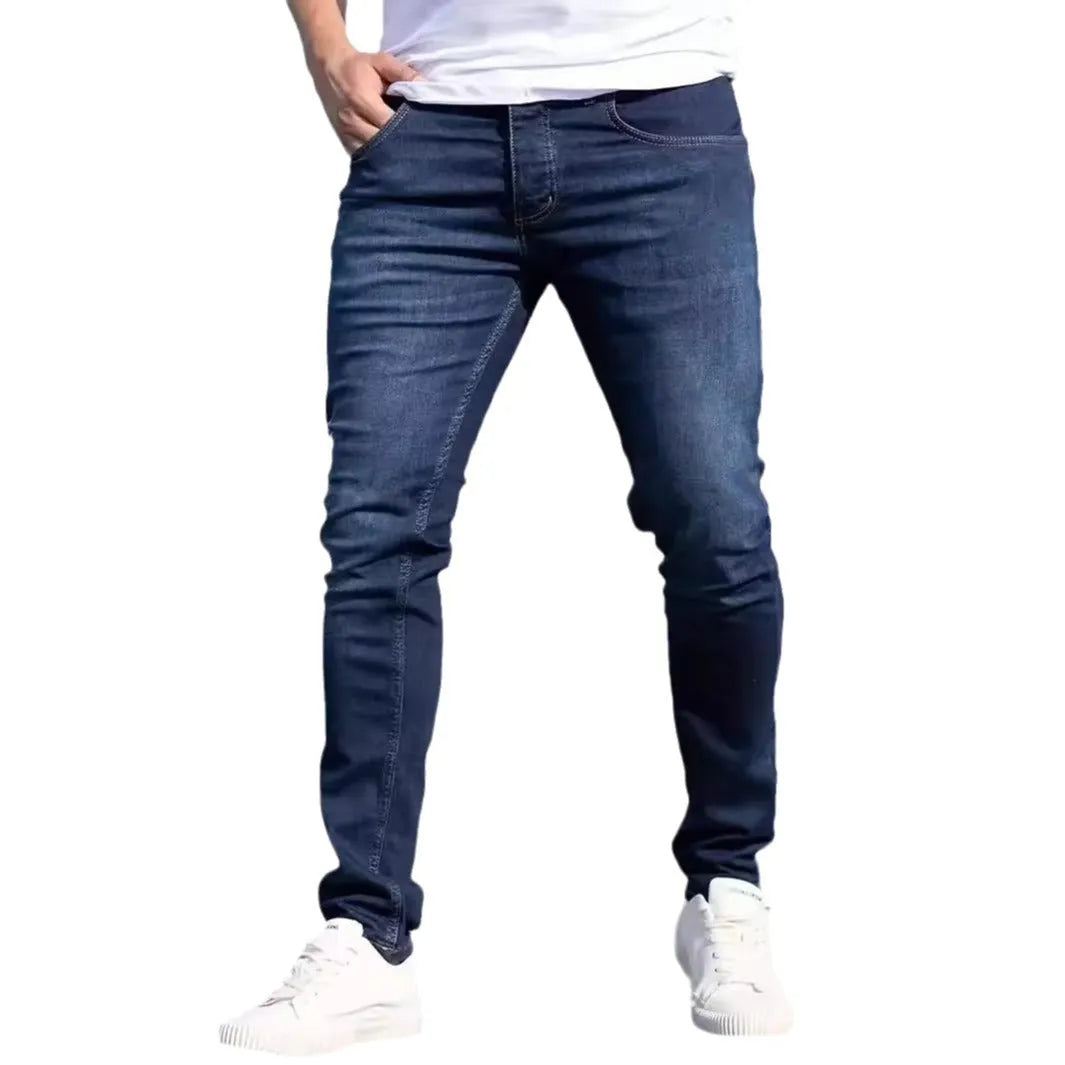 Men's dark blue slim jeans with medium elastic cotton fabric and skinny leg style