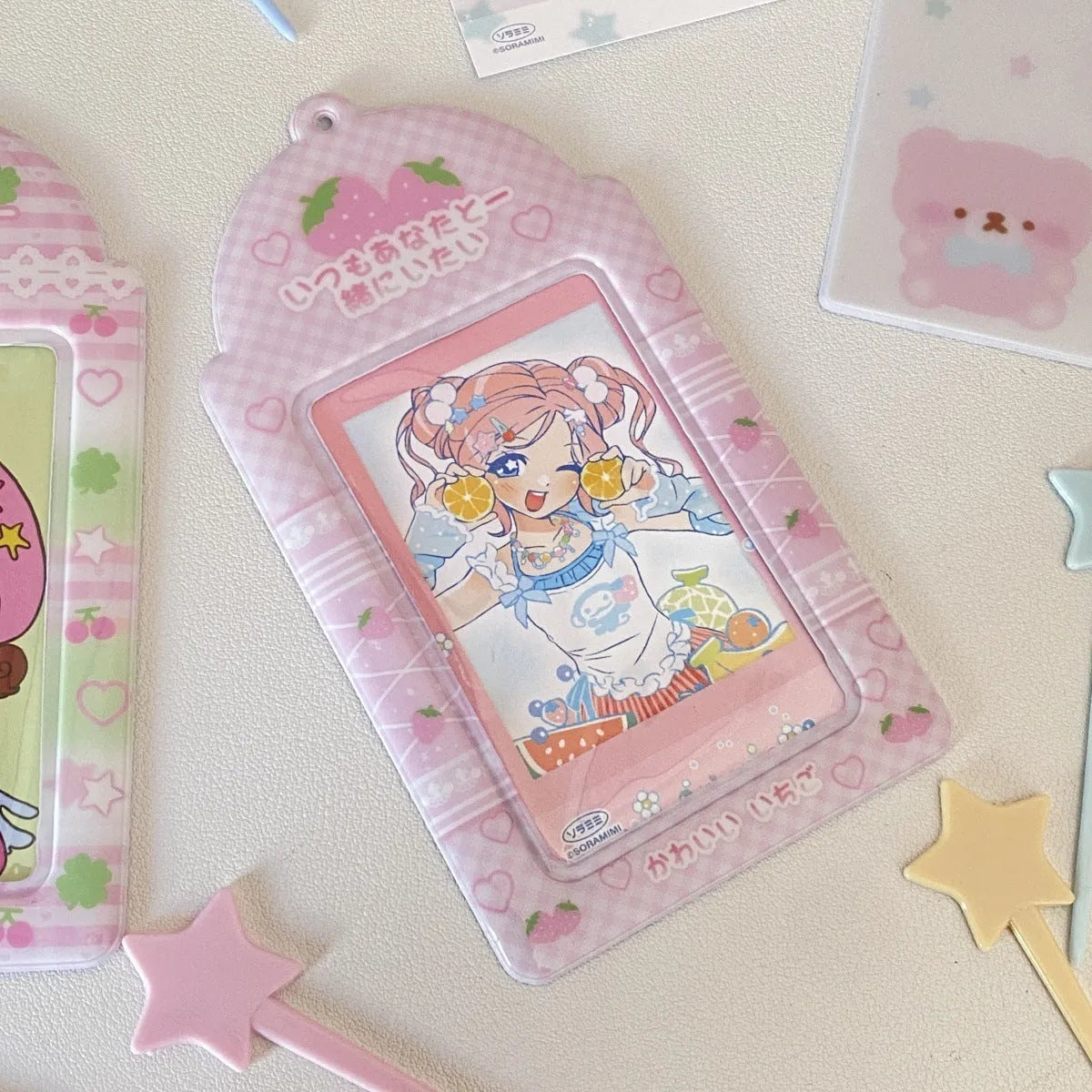 Cartoon strawberry design PVC card holder pendant with clear display pocket for lanyards.