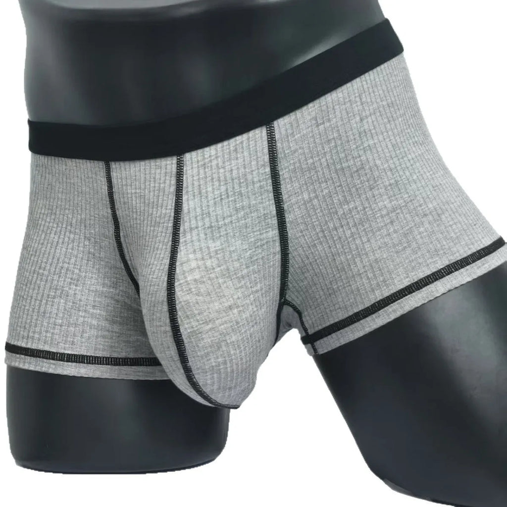 Men's solid colour thin fit boxers showing breathable fabric and body shaping design.