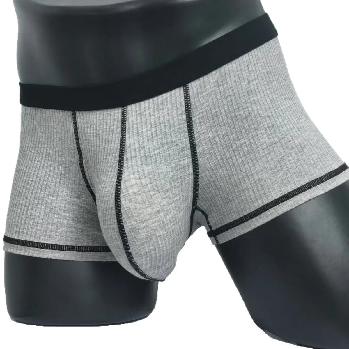 Men's solid colour thin fit boxers showing breathable fabric and body shaping design.