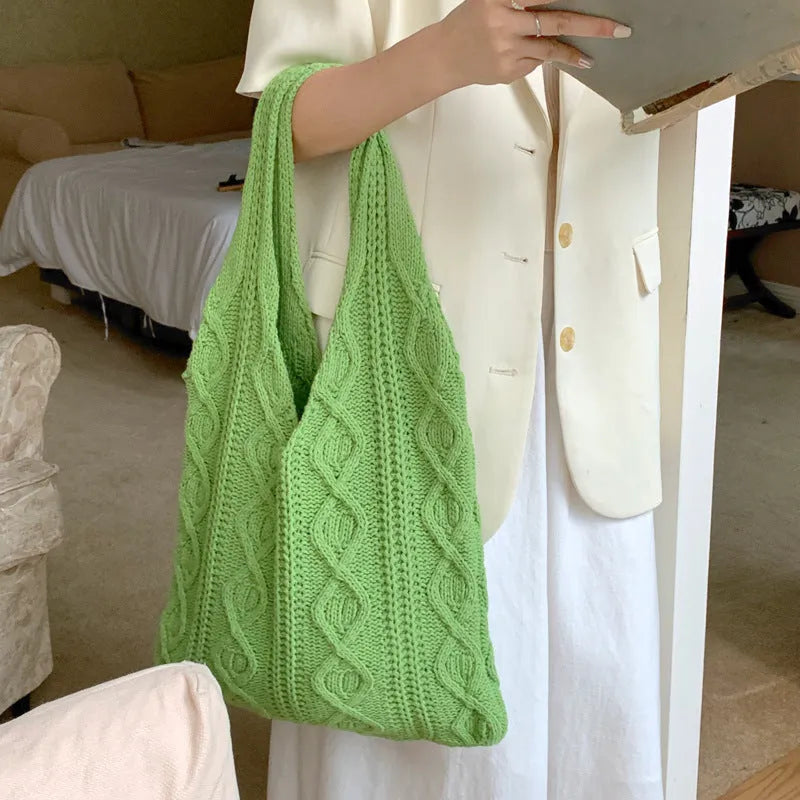 Retro hollow knitted polyester shoulder bag measuring 55cm by 37cm in solid colour with double straps
