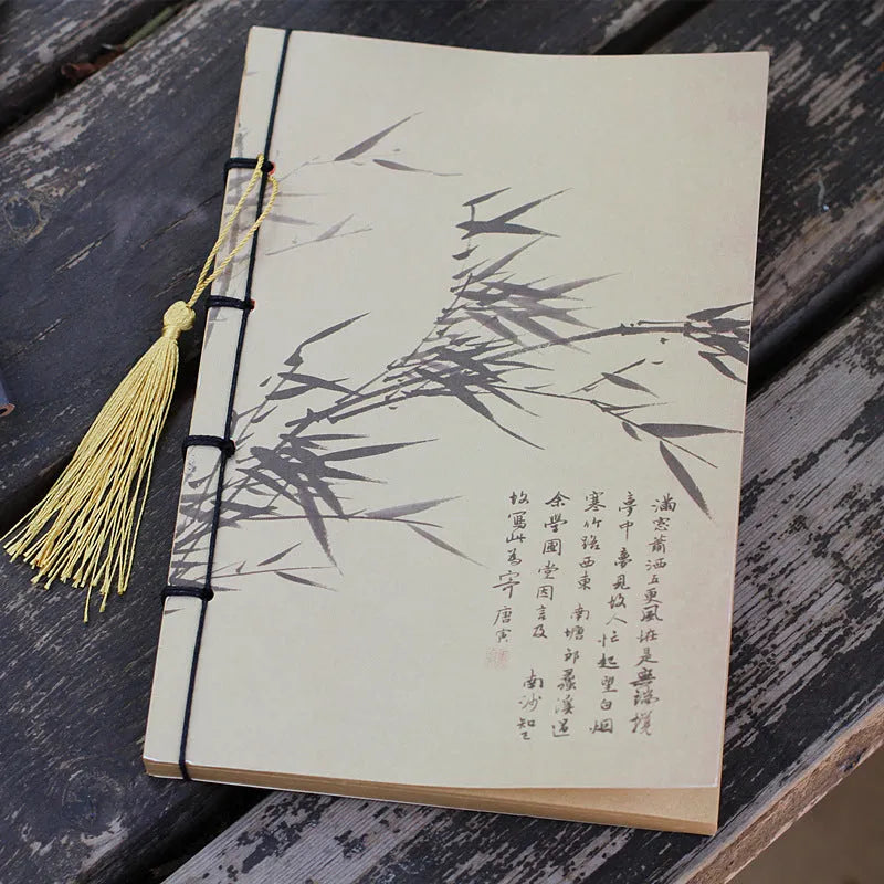 Antique wire-bound notebook with embossed cowhide cover and black wax rope binding