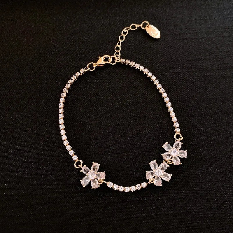 Women's gold colour copper bracelet with geometric zircon inlays and quadrilateral design