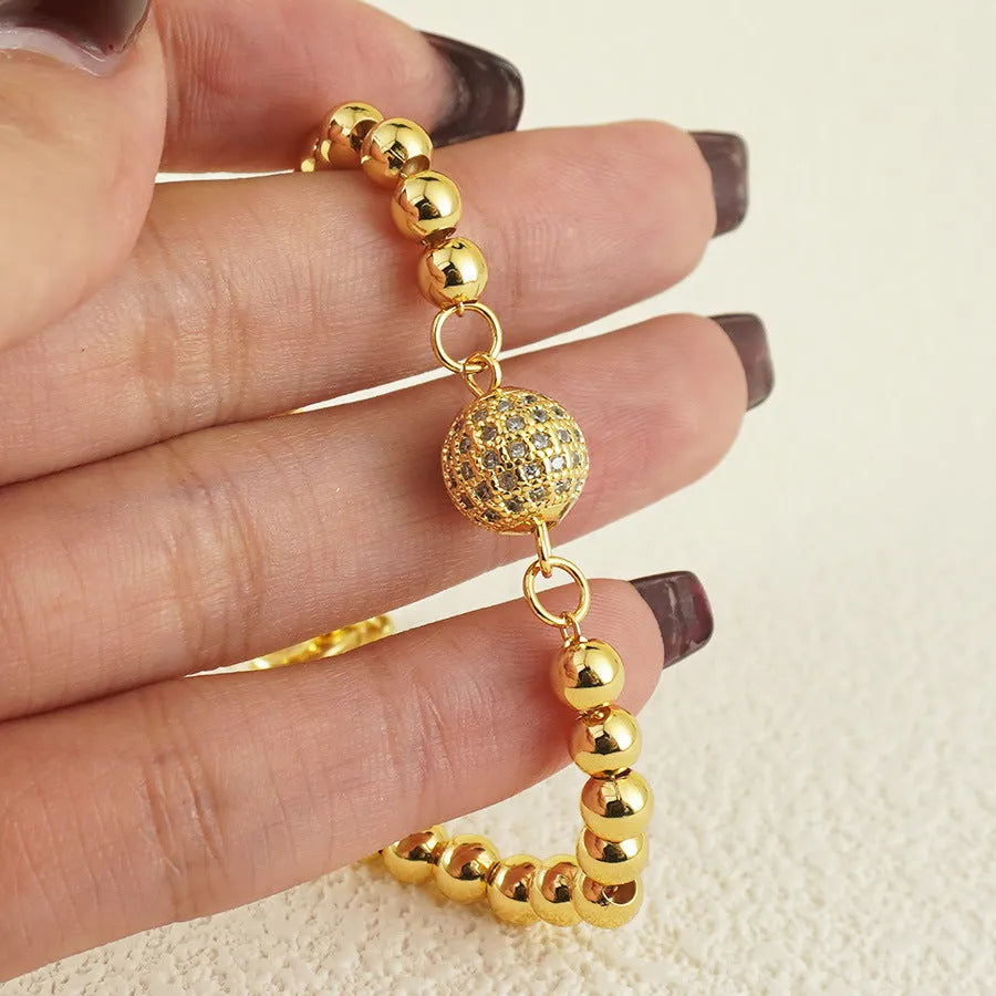 Women's heart-shaped copper bracelet with single ball zircon accents and electroplated finish