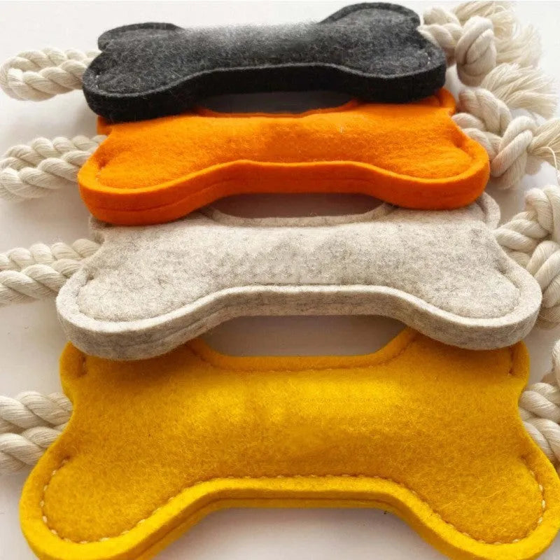 Blue bone-shaped dog toy made of felt with rope knots, shown on a white background.