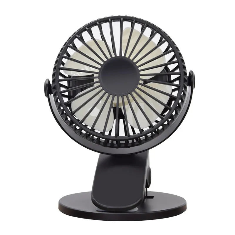 A white portable clip fan with plastic blades, showing its USB charging port and piano button switch.