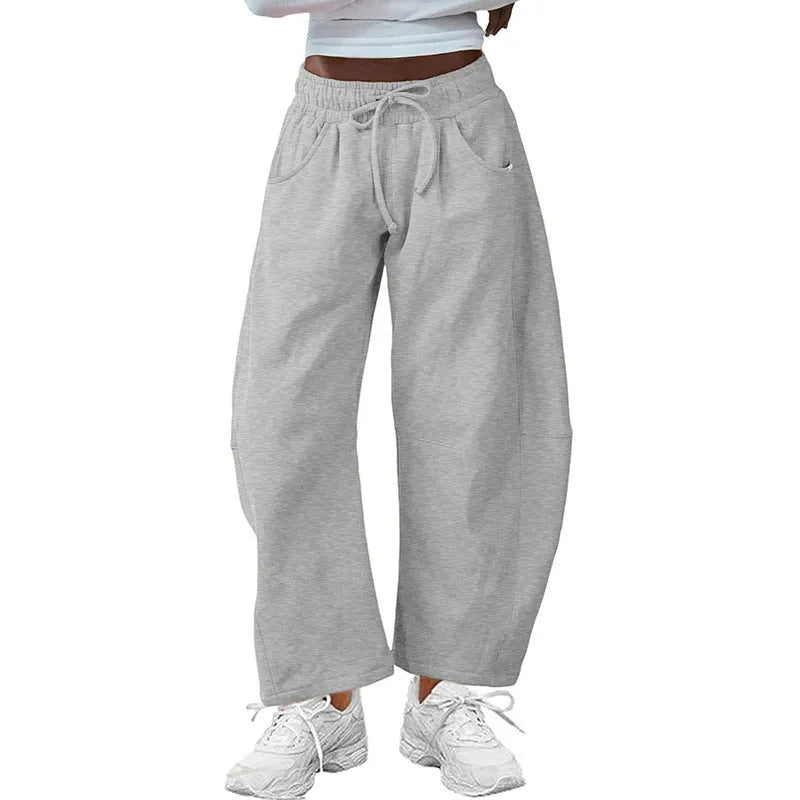 Women's loose cotton cropped sweatpants with drawstring waist in street fashion styling