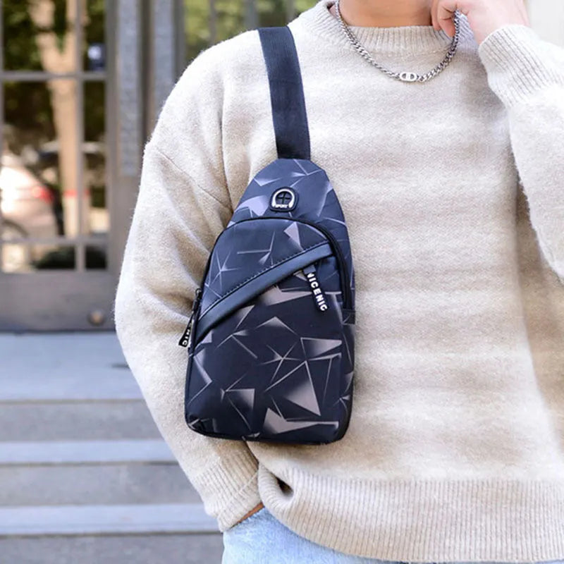 Men's blue crossbody sling bag with earphone hole showing square shape and strap