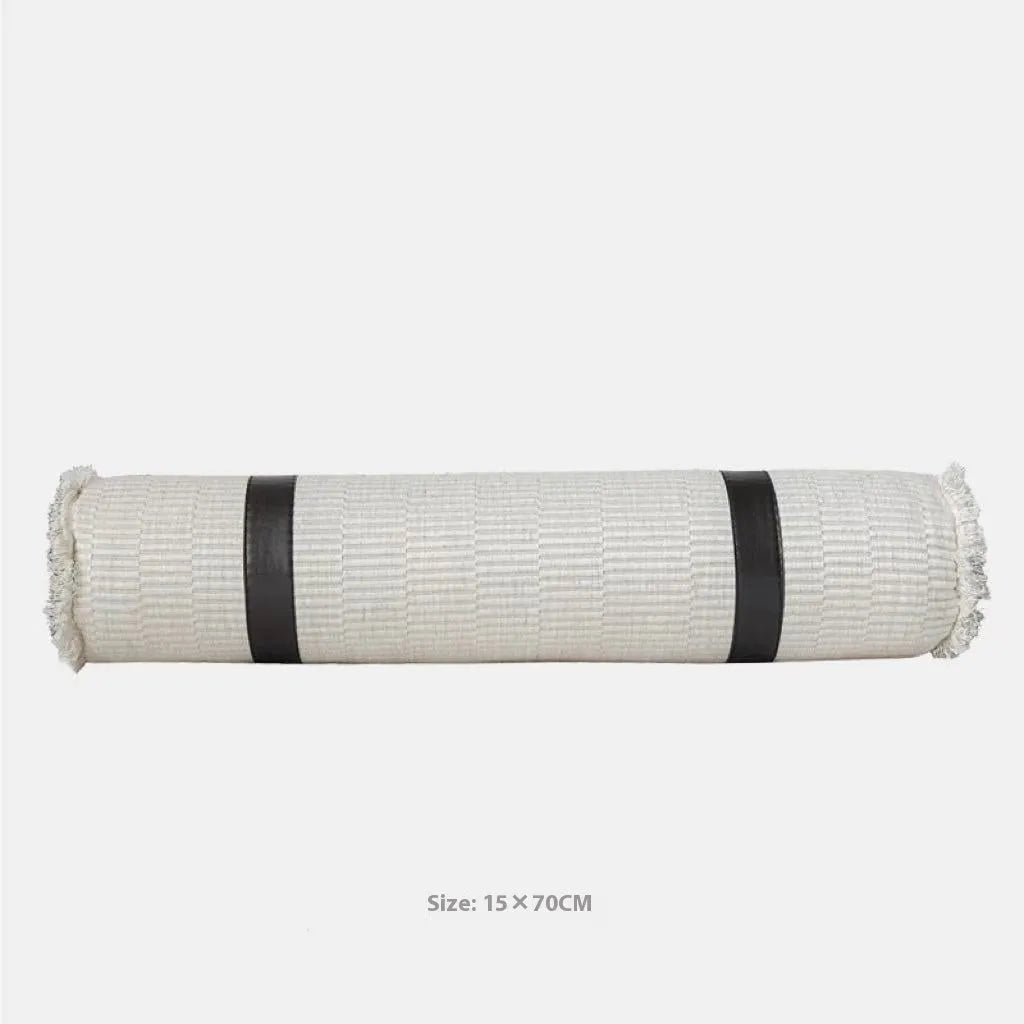 Modern grey and white plaid bed runner blanket set with a pillowcase and leather round pillow on a 1.5m bed.
