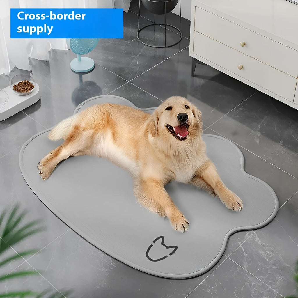 Dog cooling mat made of ice silk in a dog head shape, shown in light grey on a wooden floor.