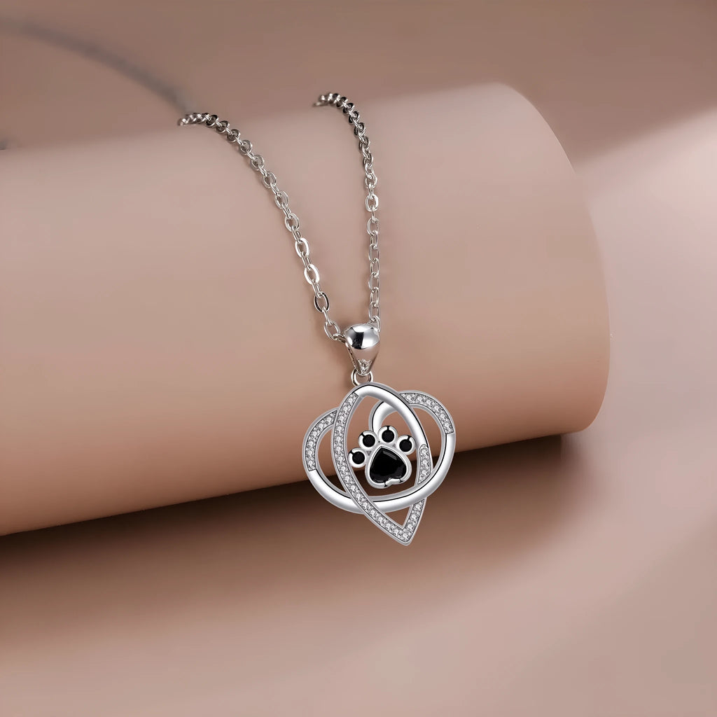 Copper pendant necklace with dogs and cats paw print design on cross chain