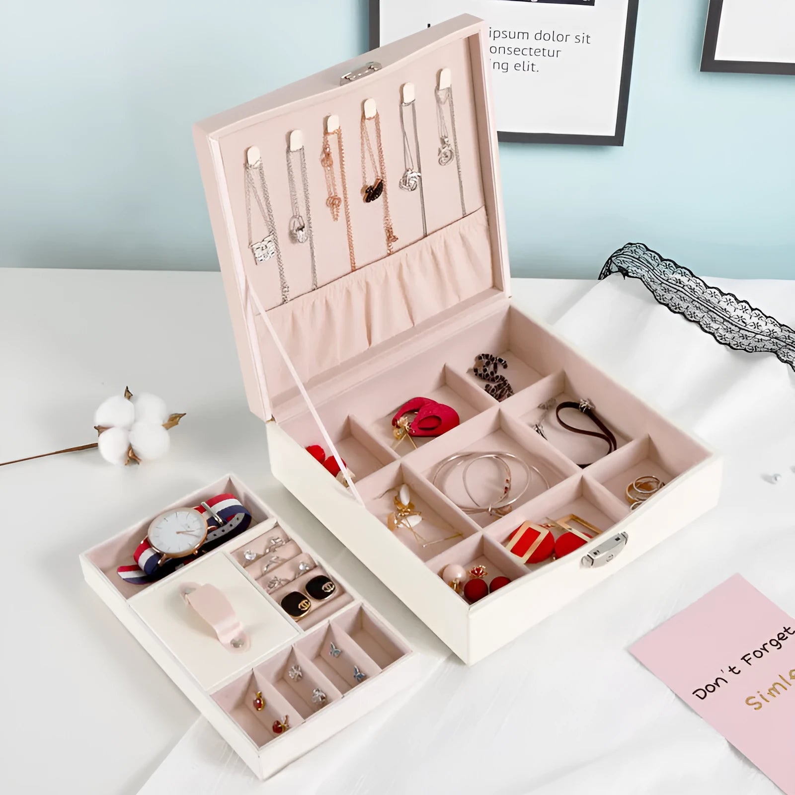 Red jewellery storage box with separate compartments for necklaces and rings
