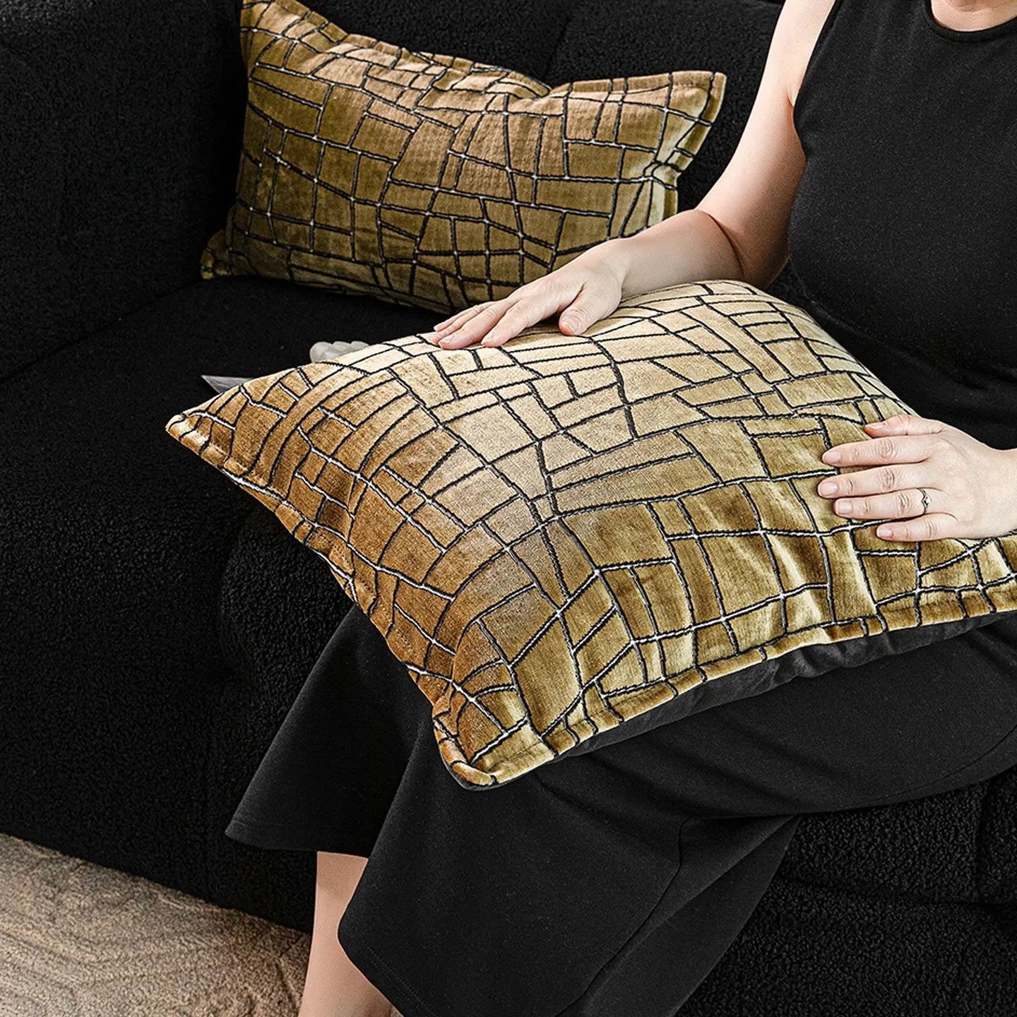 Gold and white abstract geometric patterned cushion cover on a grey sofa, showing 45x45cm square size option.